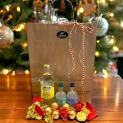 Julegave med mini gin, tonic og flowpakket chokolade