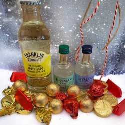 Julegave med mini gin, tonic og flowpakket chokolade