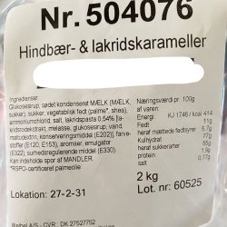 Varedeklaration og ingrediensliste til Weibel karameller: Overskueligt billede af indholdsfortegnelsen p� papir med varenummer 504070, stillet op mod et lyst tr�underlag.