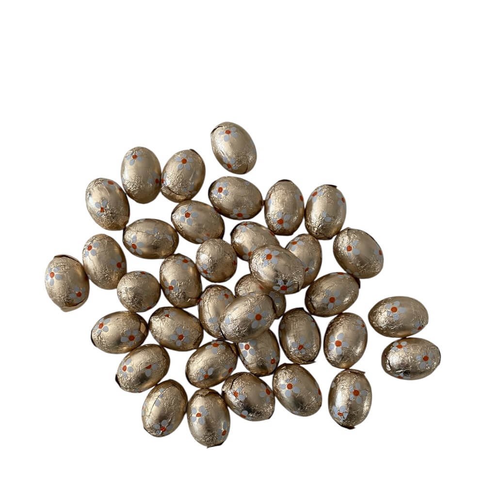 Sm� chokolade p�ske�g i guldpapir med karamelcreme - 250g.