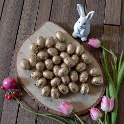 Sm� chokolade p�ske�g i guldpapir med karamelcreme - 250g.